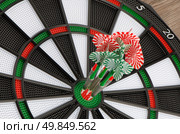 Closeup of dart board with darts. Стоковое фото, агентство Ingram Publishing / Фотобанк Лори