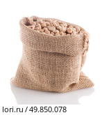 Uncooked chickpeas Uncooked chickpeas on burlap bag on white background. Стоковое фото, агентство Ingram Publishing / Фотобанк Лори