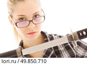 attractive businesswoman in glasses with a katana. Стоковое фото, агентство Ingram Publishing / Фотобанк Лори
