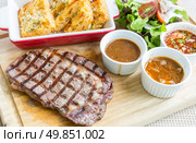 australian wagyu rib-eye beef steak serve with fresh vegetable. Стоковое фото, агентство Ingram Publishing / Фотобанк Лори