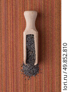 Top view of poppy seeds against red vinyl background. Стоковое фото, агентство Ingram Publishing / Фотобанк Лори