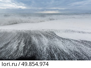 The black sand beach of Reynisfjara Dyrholaey promontory in the southern coast of Iceland. Стоковое фото, агентство Ingram Publishing / Фотобанк Лори
