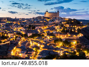 Toledo Cityscape with Alcazar at dusk in Madrid Spain. Стоковое фото, агентство Ingram Publishing / Фотобанк Лори