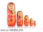 Five red Babushka on white reflective background. Стоковое фото, агентство Ingram Publishing / Фотобанк Лори