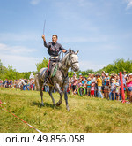 Russia, Samara, June 2016: A dashing Cossack on horseback during a demonstration performance at the Journey to the Past festival. Редакционное фото, фотограф Акиньшин Владимир / Фотобанк Лори