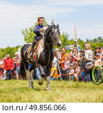 Russia, Samara, June 2016: A dashing Cossack on horseback during a demonstration performance at the Journey to the Past festival. Редакционное фото, фотограф Акиньшин Владимир / Фотобанк Лори