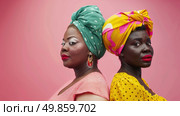 Two women, wearing headscarves, are standing side by side. Стоковое AI-изображение, AI-художник Данила Большаков / Фотобанк Лори