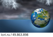 European Financial Crisis as an earth planet of European union drowning in debt sinking in water during a storm with lightning as an economic Euro debt warning and banking crisis with countries as France Italy Greece Spain Portugal elements of this image furnished by NASA. Стоковое фото, агентство Ingram Publishing / Фотобанк Лори