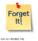 Forget it office note on a white background as a symbol of forgetting about doing something or never mind procrastination overloook a task and stop a planned strategy with text on a yellow sticky note and a red push pin. Стоковое фото, агентство Ingram Publishing / Фотобанк Лори