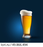 Beer in glass on blue background. Стоковое фото, агентство Ingram Publishing / Фотобанк Лори