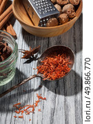 saffron with various spices on wooden background - anise, cinnamon, ginger, nutmeg, Стоковое фото, агентство Ingram Publishing / Фотобанк Лори