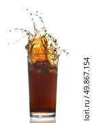 Beautiful splash of cola in glass isolated on white. Стоковое фото, агентство Ingram Publishing / Фотобанк Лори