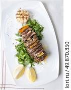 shashlik with potherbs on the plate. Стоковое фото, агентство Ingram Publishing / Фотобанк Лори