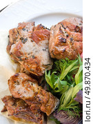 fried meat with potherbs on the plate. Стоковое фото, агентство Ingram Publishing / Фотобанк Лори