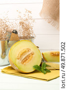 Juicy honeydew melon on a wooden table background. Стоковое фото, агентство Ingram Publishing / Фотобанк Лори