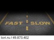 Fast and slow lanes as a business dilemma on how to proceed with a financial plan and strategy in terms of growing more conservative or aggressive growth as an asphalt road with yellow painted dividing lines. Стоковое фото, агентство Ingram Publishing / Фотобанк Лори