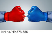 Business fight strategy with two boxing gloves in the shape of human faces head to head and facing each other as competitive rivals and opponents in a strtegic competition. Стоковое фото, агентство Ingram Publishing / Фотобанк Лори