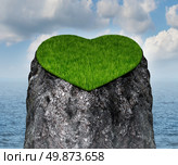 Valentine heart shaped mountain cliff island surrounded by water as a lonely and romantic symbol of the challenges of dating and searching for a loving relationship and abstinence from sex. Стоковое фото, агентство Ingram Publishing / Фотобанк Лори