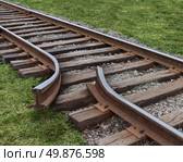 Strategy obstruction challenges with a train track that is broken as a business concept of a road block and finding solutions to obstacles that are dangerous and challenging as  journey on a strategic goal. Стоковое фото, агентство Ingram Publishing / Фотобанк Лори