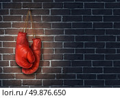 Stop competing and putting an end to business competition by hanging up a pair of red boxing gloves on a dark rustic old brick wall as a concept of stopping the fight to find the cure. Стоковое фото, агентство Ingram Publishing / Фотобанк Лори