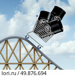 Falling oil prices and plunging fuel costs as a group of oil barrels or steel drum containers in a shopping cart going down on a roller coaster as a business concept of low energy pricing and the unstable nature of commodities. Стоковое фото, агентство Ingram Publishing / Фотобанк Лори