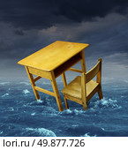 Education problems concept with an old school desk drowning in the water during a storm as a symbol of inaccessible schooling and funding challenges for special learning and literacy programs for underprivileged poor students. Стоковое фото, агентство Ingram Publishing / Фотобанк Лори