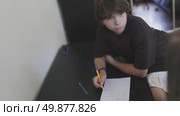 Boy learning math with teacher's help. Стоковое видео, видеограф Константин Шишкин / Фотобанк Лори