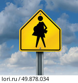 Teenage pregnancy and sex education contraceptive usage social concept as a symbol of sexually active teens that result in unplanned pregnant school students with a yellow school crossing sign with an expecting teen mother. Стоковое фото, агентство Ingram Publishing / Фотобанк Лори