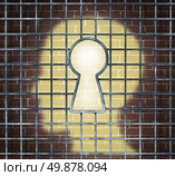 Creative freedom key with a human head light glowing on a brick wall through a prison cage opened with a keyhole shape as a business and mental health concept searching for innovative solutions to be set free for success. Стоковое фото, агентство Ingram Publishing / Фотобанк Лори