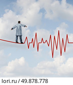 Doctor diagnosis danger and risk as a medical concept and health care metaphor with a physician in a lab coat walking on a tightrope or high wire shaped as an ECG pulse trace as a symbol of  monitoring patient health safely and carefully. Стоковое фото, агентство Ingram Publishing / Фотобанк Лори