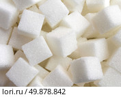 Sugar background sweet cube food ingredient background with a close up of a pile of delicious white lumps of cubes as a symbol of cooking and baking and the diet health risks related to diabetes and calorie intake. Стоковое фото, агентство Ingram Publishing / Фотобанк Лори