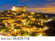 Toledo Cityscape with Alcazar at dusk in Madrid Spain. Стоковое фото, агентство Ingram Publishing / Фотобанк Лори