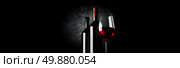 Two bottles and wineglass on a black background. Стоковое фото, агентство Ingram Publishing / Фотобанк Лори