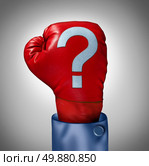 Competition questions as a business concept with a red boxing glove and a question mark stitched on the leather surface as a metaphor for strategy uncertainty and stress in choosing what industry or competitor to compete with. Стоковое фото, агентство Ingram Publishing / Фотобанк Лори