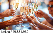 A group of individuals celebrating with glasses of champagne, making a toast in a social gathering. Стоковое AI-изображение, AI-художник Данила Большаков / Фотобанк Лори