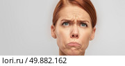 A woman with a startled look on her face, showing wide eyes and an open mouth in reaction to unexpected news or sight. Стоковое AI-изображение, AI-художник Данила Большаков / Фотобанк Лори