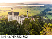 Beautiful summer sunset view of the Neuschwanstein castle at Fussen Bavaria, Germany. Стоковое фото, агентство Ingram Publishing / Фотобанк Лори