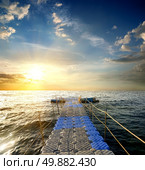 Pontoon with handrails in the sea at sunset. Стоковое фото, агентство Ingram Publishing / Фотобанк Лори