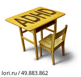 ADHD Concept for hyperactivity disorder and attention deficit  behavior as a school desk with the letters carved into the wooden table as a healthcare symbol for childhood mental health issues. Стоковое фото, агентство Ingram Publishing / Фотобанк Лори