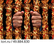 Junk food addiction and eating unhealthy lifestyle concept with aprison bars shaped made of  fried chicken hamburgers and hot dogs processed meat products and french fries as a symbol of the dangers of being trapped by sugar fat and salt. Стоковое фото, агентство Ingram Publishing / Фотобанк Лори