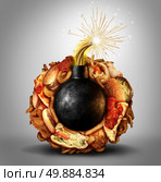 Junk food time bomb health concern concept as a high medical risk fat diet symbol and over eating lifestyle danger with a burning fuse surrounded by greasy snacks as hamburgers and fried takeaway binge eating. Стоковое фото, агентство Ingram Publishing / Фотобанк Лори