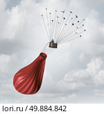 Business team solution concept and teamwork recovery symbol as a businessman in a deflated broken red hot air balloon being saved and rescued by a group of flying birds pulling the object upward with wires. Стоковое фото, агентство Ingram Publishing / Фотобанк Лори