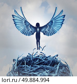 Angel concept and angelic metaphor as a human with open wings rising out of a nest into the clouds as a symbol of hope and the aspirations of life and to ascend to personal learning achievement. Стоковое фото, агентство Ingram Publishing / Фотобанк Лори