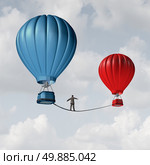 Change challenge and caution business motivational concept as person walking on a tight rope high wire from one hot air balloon to another as taking a risk and danger metaphor for changing position or career. Стоковое фото, агентство Ingram Publishing / Фотобанк Лори