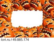Halloween horizontal frame pumpkin harvest as a group of scary carved jackolantern monsters as a concept and symbol for a creepy advertisement and marketing announcement. Стоковое фото, агентство Ingram Publishing / Фотобанк Лори