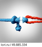 Detached concept and disconnected symbol as two different ropes tied and linked together as a breaking chain and losing trust or faith metaphor as separation and divorce or broken severed relationship. Стоковое фото, агентство Ingram Publishing / Фотобанк Лори