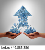 Teamwork for success business concept as two hands holding groups of gears and cogs that have come together to form an upward arrow as a symbol for financial team work growth partnership building together. Стоковое фото, агентство Ingram Publishing / Фотобанк Лори