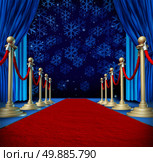 Winter red carpet background as a catwalk or runway in an auditorium stage with snowflakes falling down as a seasonal holiday celebration for newyear marketing or promotion with copyspace. Стоковое фото, агентство Ingram Publishing / Фотобанк Лори