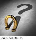 Chance question and luck questions as a horseshoe icon or horse shoe odds symbol as a golden metal lucky charm object as a metaphor for fortune and lotto or lottery success uncertainty and prediction risk. Стоковое фото, агентство Ingram Publishing / Фотобанк Лори
