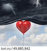 Psychology of human love or a happy romantic feeling as an antidepressant as a red heart shaped balloon lifting up and away a dark storm cloud background as a happiness metaphor for mood change in the mind. Стоковое фото, агентство Ingram Publishing / Фотобанк Лори